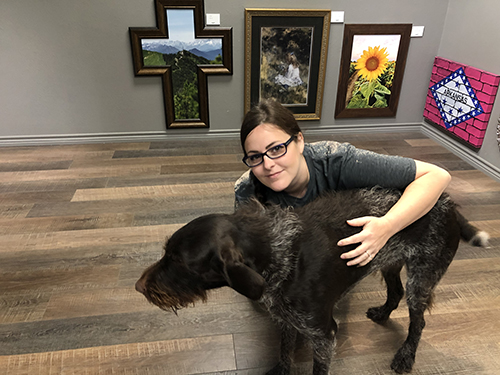 Person with Dog, canvas photos in background